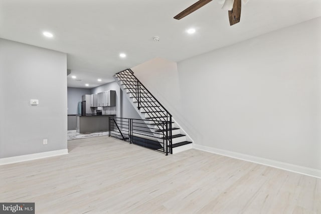 interior space with ceiling fan and light hardwood / wood-style flooring