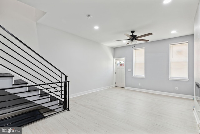 foyer featuring light hardwood / wood-style floors and ceiling fan