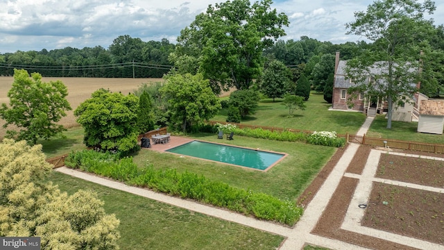 view of pool featuring a yard