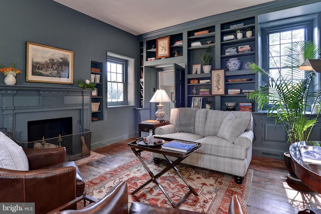 living room featuring hardwood / wood-style floors and a wealth of natural light