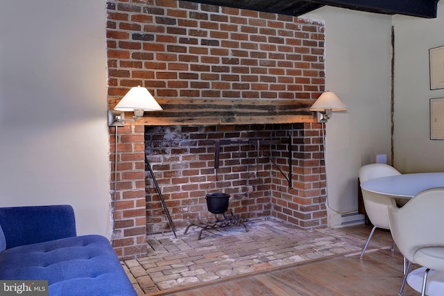 interior space featuring hardwood / wood-style floors and baseboard heating