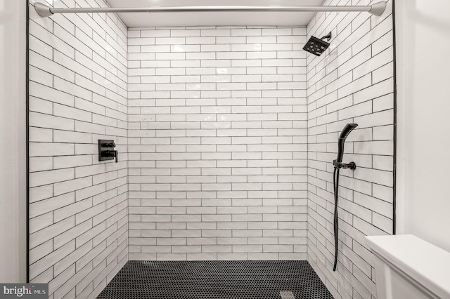 bathroom with tiled shower