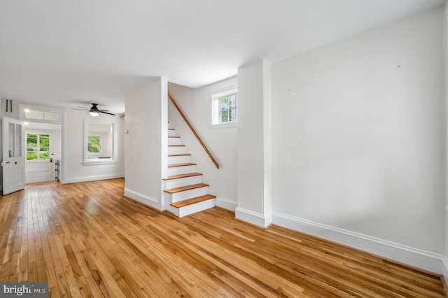 interior space featuring wood-type flooring and ceiling fan