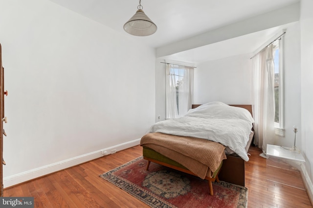 bedroom with hardwood / wood-style floors