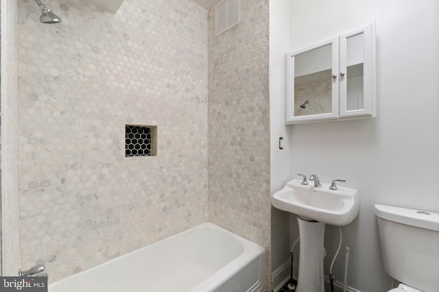 bathroom featuring a bathtub and toilet