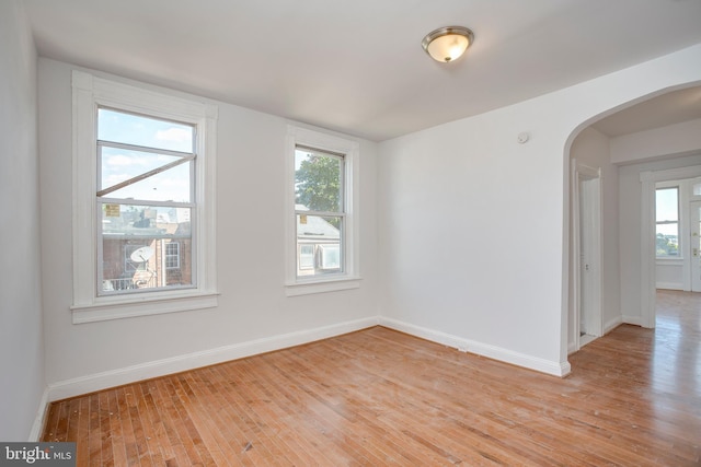 unfurnished room featuring light wood-type flooring