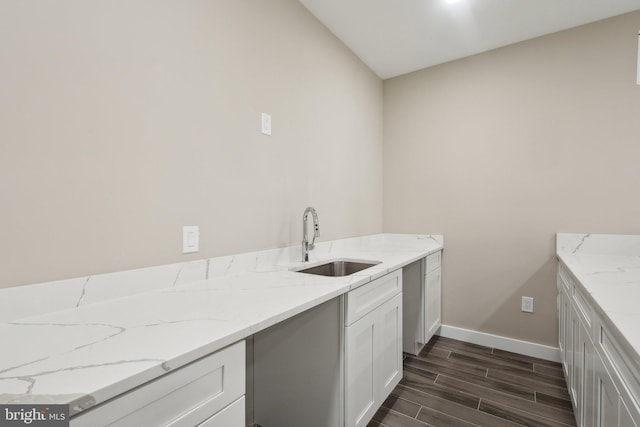 clothes washing area featuring sink