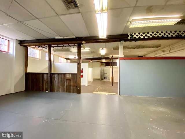 basement featuring a paneled ceiling