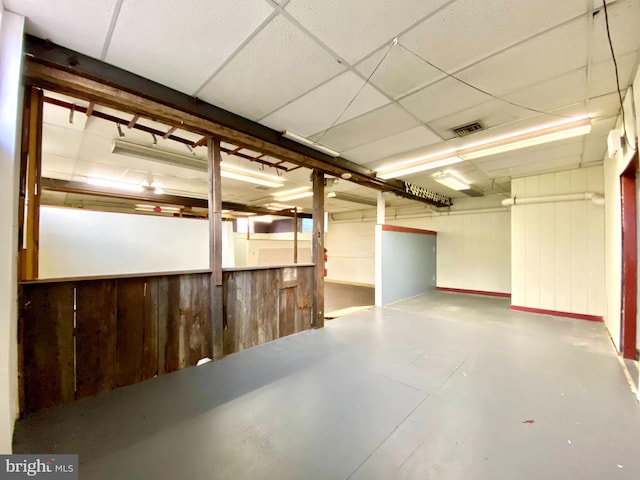 basement featuring a drop ceiling