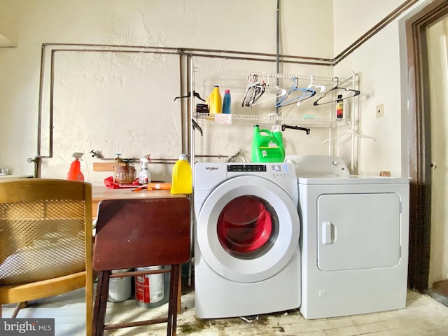 washroom featuring washer and clothes dryer