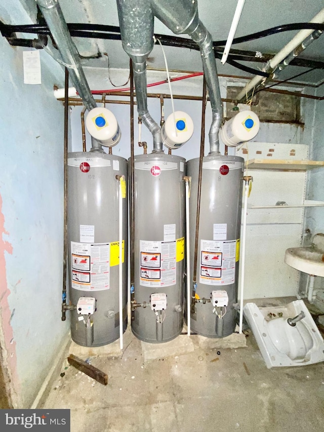 utility room featuring sink and gas water heater