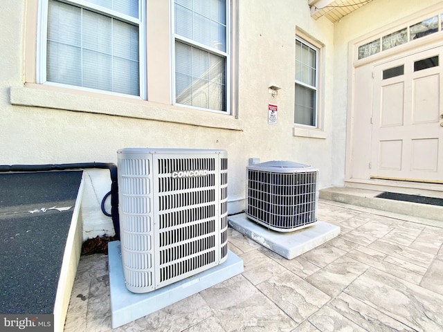 details featuring tile floors and central AC unit