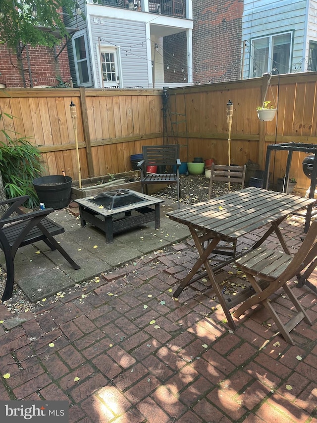 view of patio featuring a fire pit