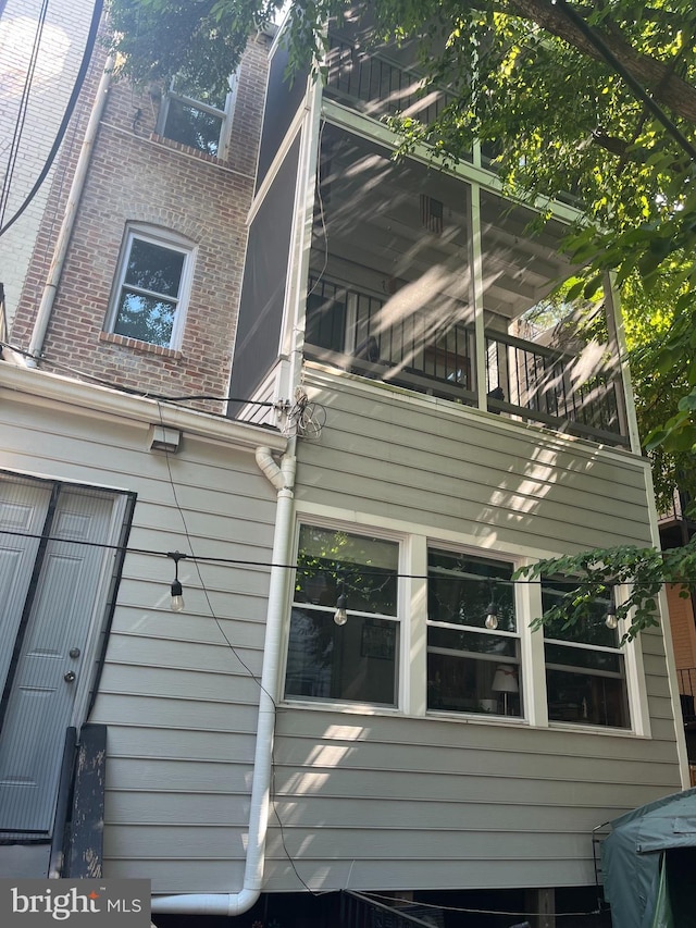 view of property exterior featuring a balcony