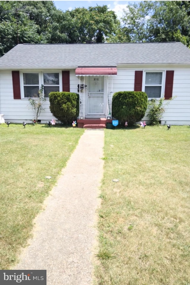 ranch-style house with a front lawn