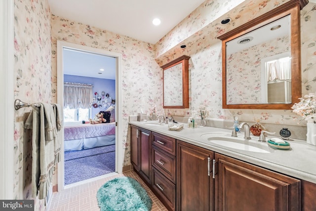 bathroom featuring tile patterned flooring and vanity