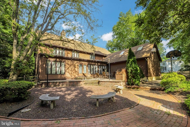 rear view of property with a patio area