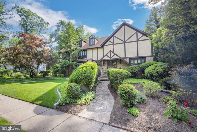 tudor house with a front lawn