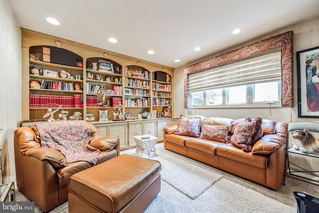 sitting room featuring carpet and built in features