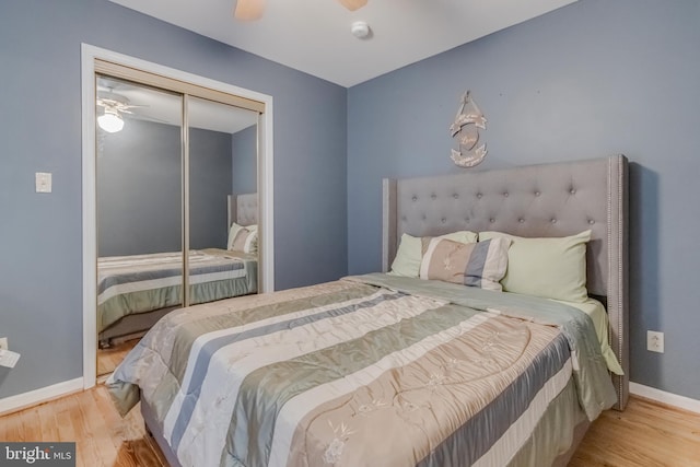 bedroom featuring ceiling fan, a closet, and light hardwood / wood-style flooring