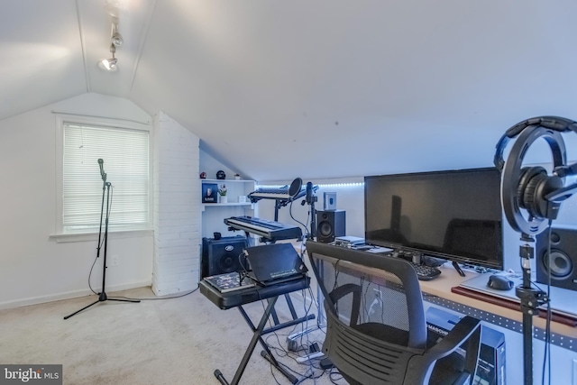 office featuring light carpet and vaulted ceiling