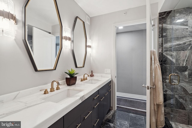 bathroom with vanity and a shower with door