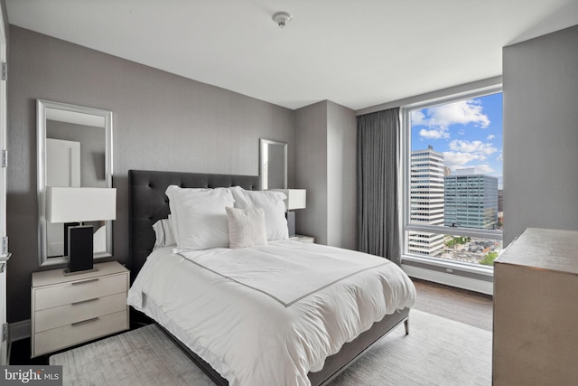 bedroom with light hardwood / wood-style flooring