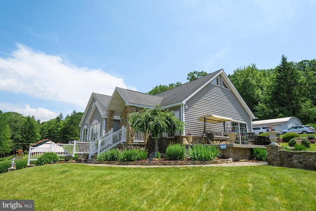 view of side of property with a lawn