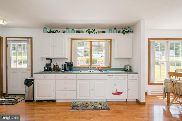 kitchen with light wood-type flooring, white dishwasher, a baseboard heating unit, sink, and white cabinetry