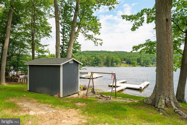 exterior space featuring a water view and a boat dock