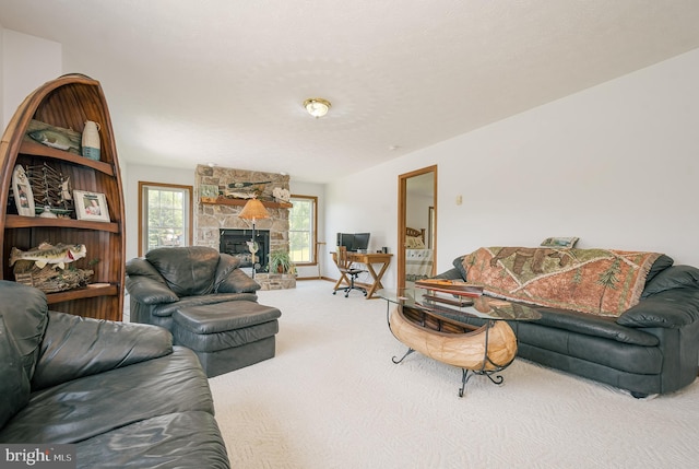 carpeted living room with a fireplace