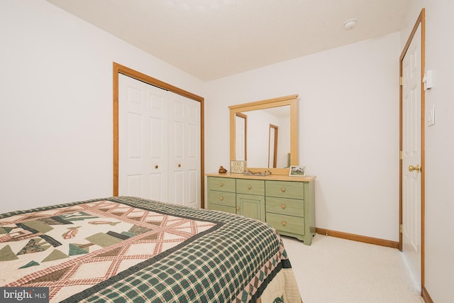 carpeted bedroom with a closet