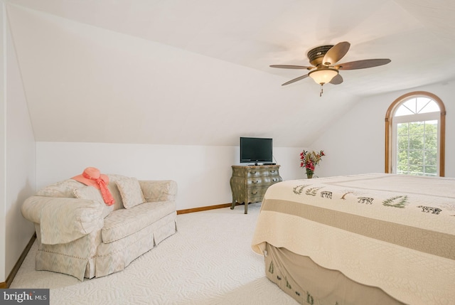 carpeted bedroom featuring ceiling fan and lofted ceiling