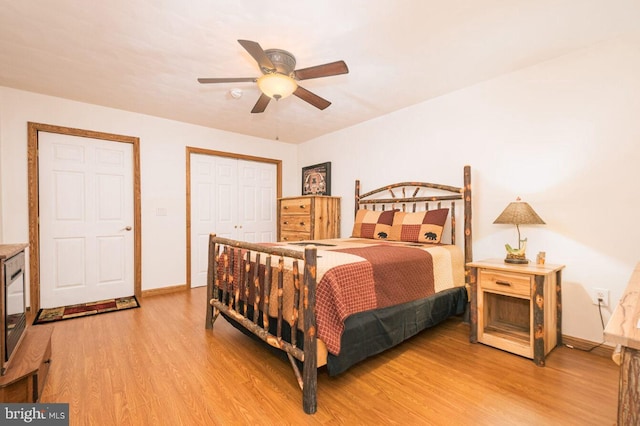 bedroom with a closet, ceiling fan, and hardwood / wood-style flooring