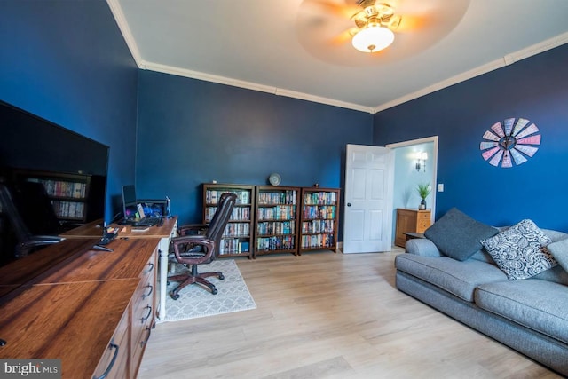 home office with wood finished floors and crown molding