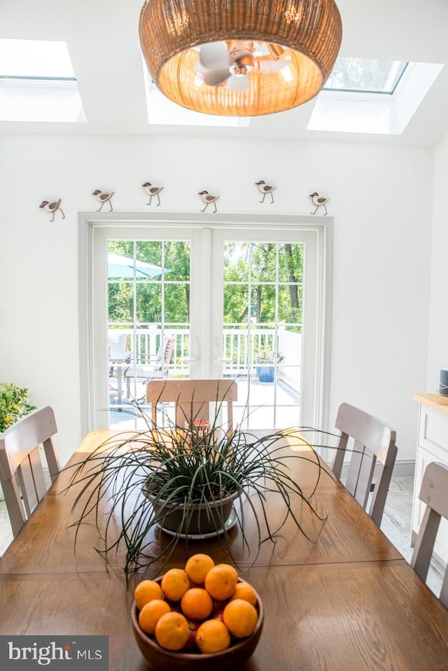 dining room with a skylight