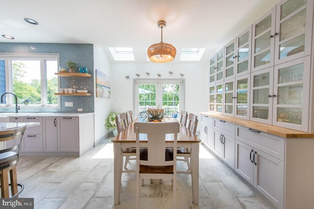 dining area featuring recessed lighting and a skylight