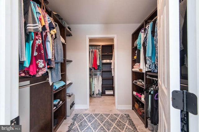 walk in closet featuring light wood-type flooring