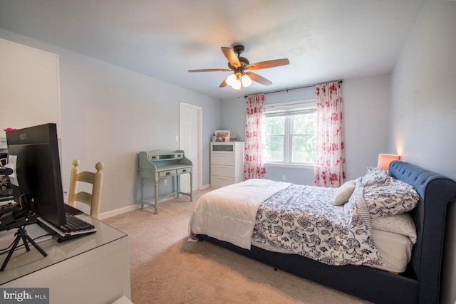 carpeted bedroom featuring a ceiling fan and baseboards