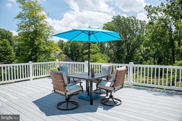 wooden deck with outdoor dining area