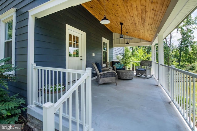 view of patio with a porch and a ceiling fan