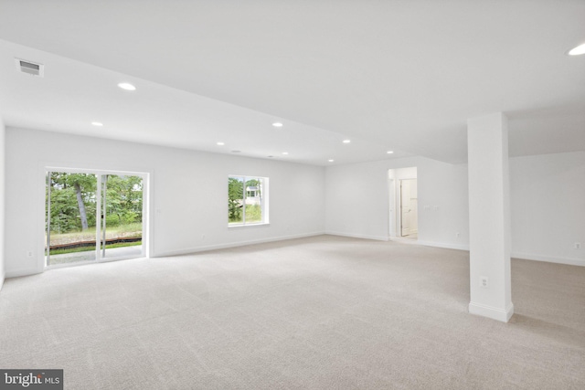 unfurnished room with light carpet