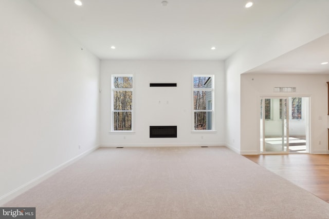 5095 Maple Ridge Way, Emmaus, PA 18049 - unfurnished living room with recessed lighting, a fireplace, baseboards, wood finished floors, and carpet floors