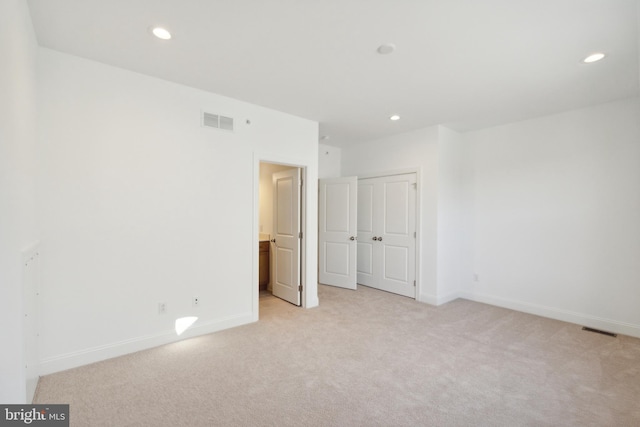 interior space featuring light colored carpet