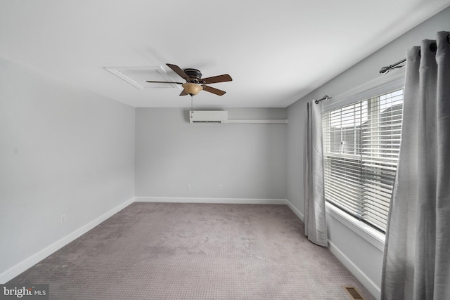 unfurnished room featuring light colored carpet, a wall mounted AC, and ceiling fan