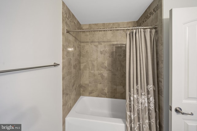 bathroom with shower / bathtub combination with curtain