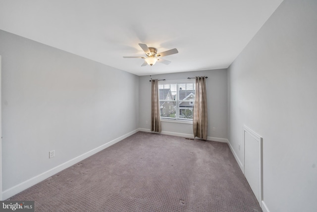 empty room with carpet and ceiling fan