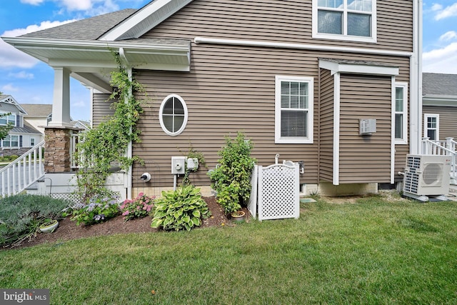 view of property exterior with a lawn