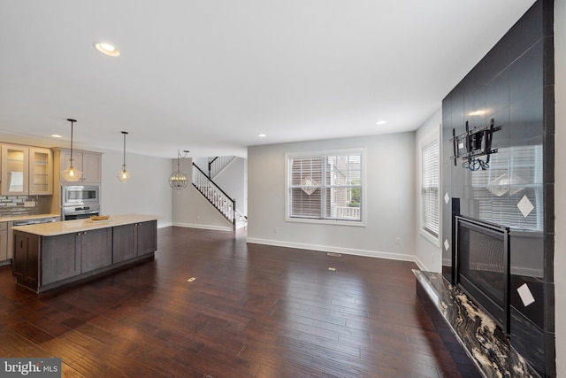 living room featuring a fireplace and dark hardwood / wood-style flooring