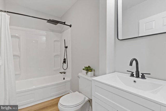 full bathroom featuring hardwood / wood-style flooring, vanity, toilet, and shower / tub combo with curtain